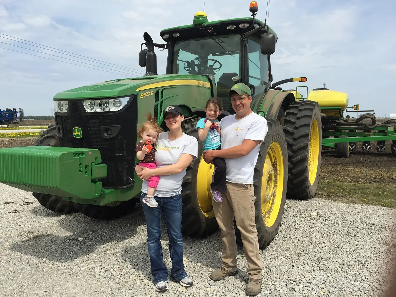 Family gathered around a tractor